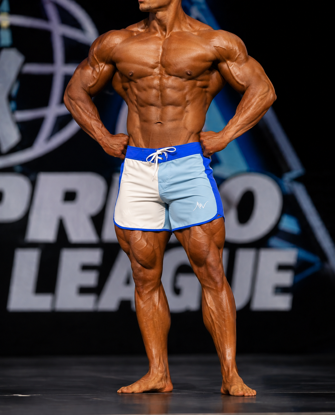 Muscular male bodybuilder posing on stage wearing Arctic Blue blue and white color-block Men&