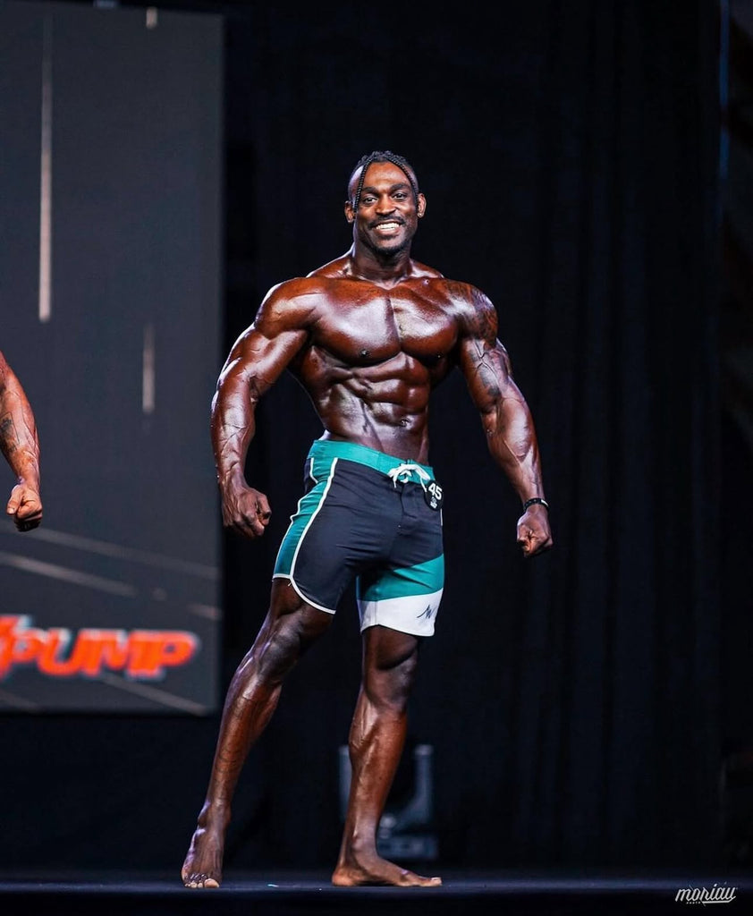 Green & Black Men's Physique Competition Board Shorts: Stand