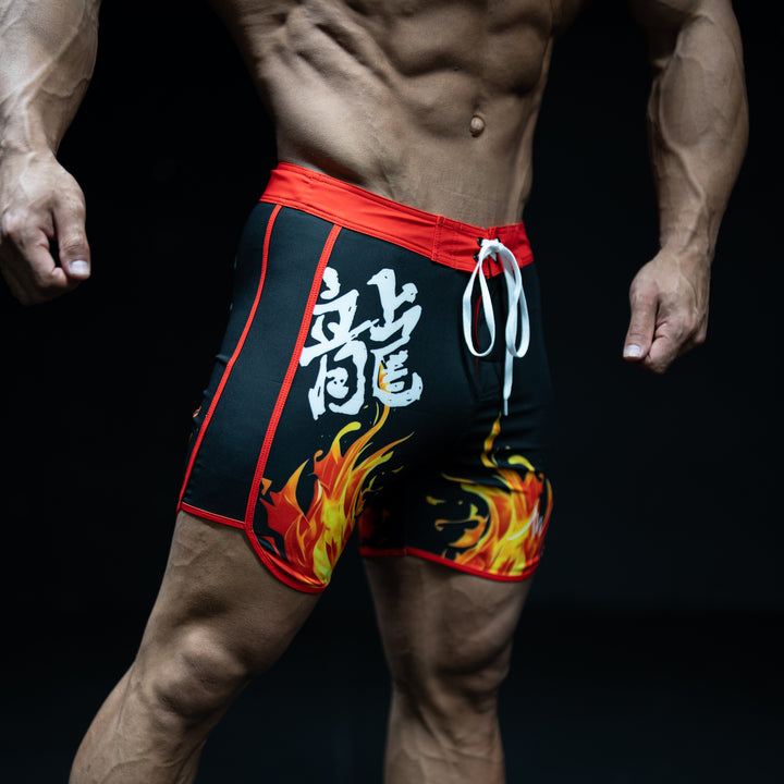 Muscular male athlete wearing Enjin black and red Men&