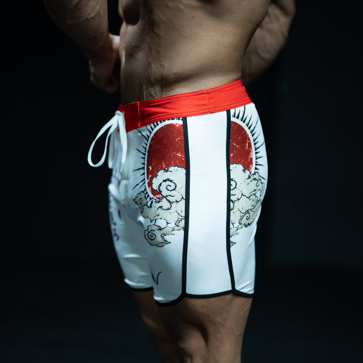 Rear view of muscular male athlete wearing Kaisen white, black, and red Japanese-inspired Men&